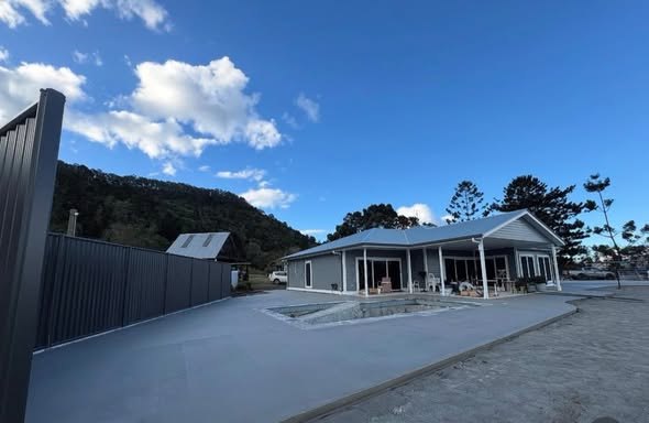 Concrete surround poured around a home and pool area