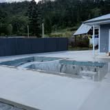 Concrete pool surround poured beside a pool